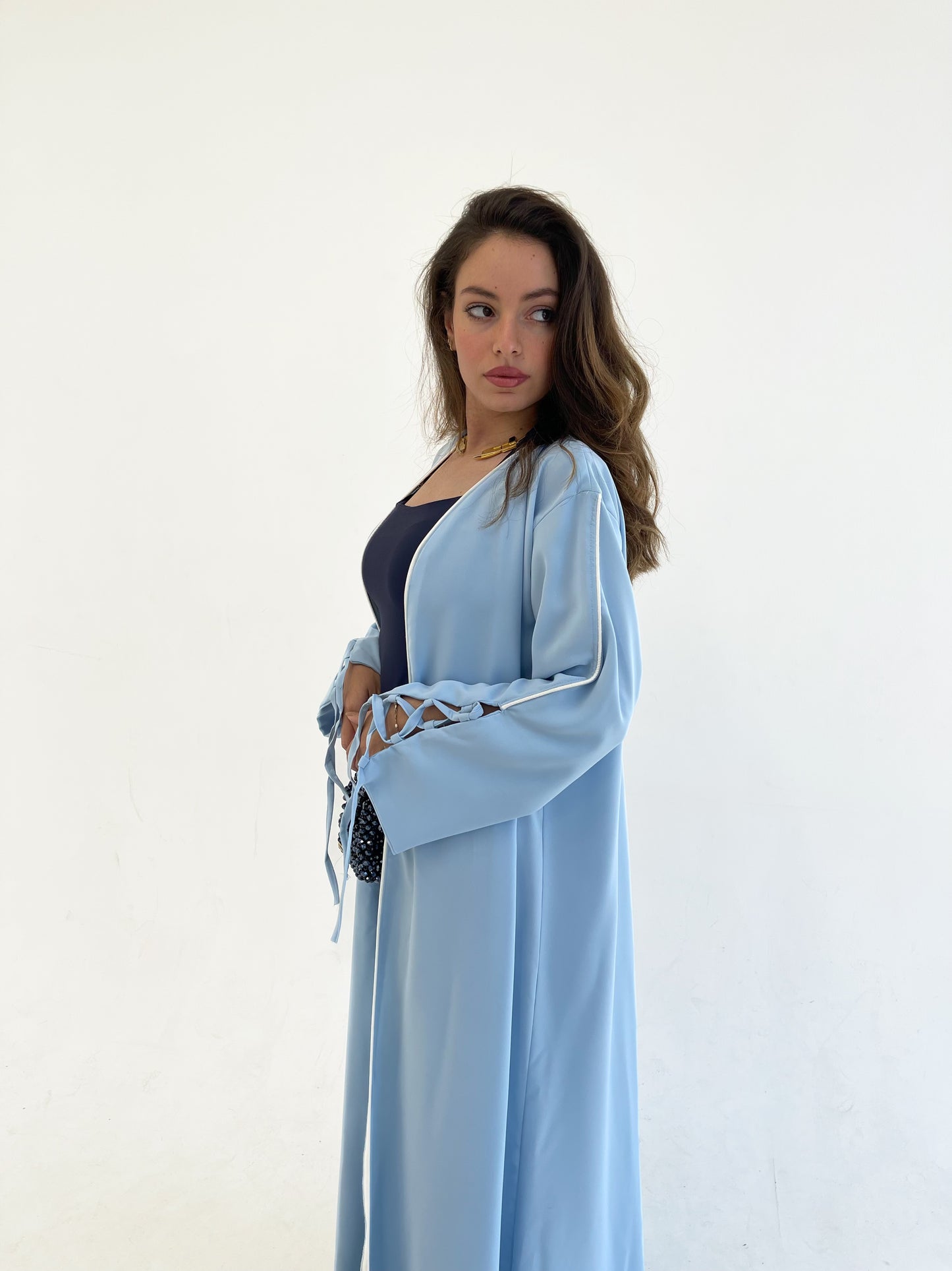 Dolly Baby blue Abaya with White details.