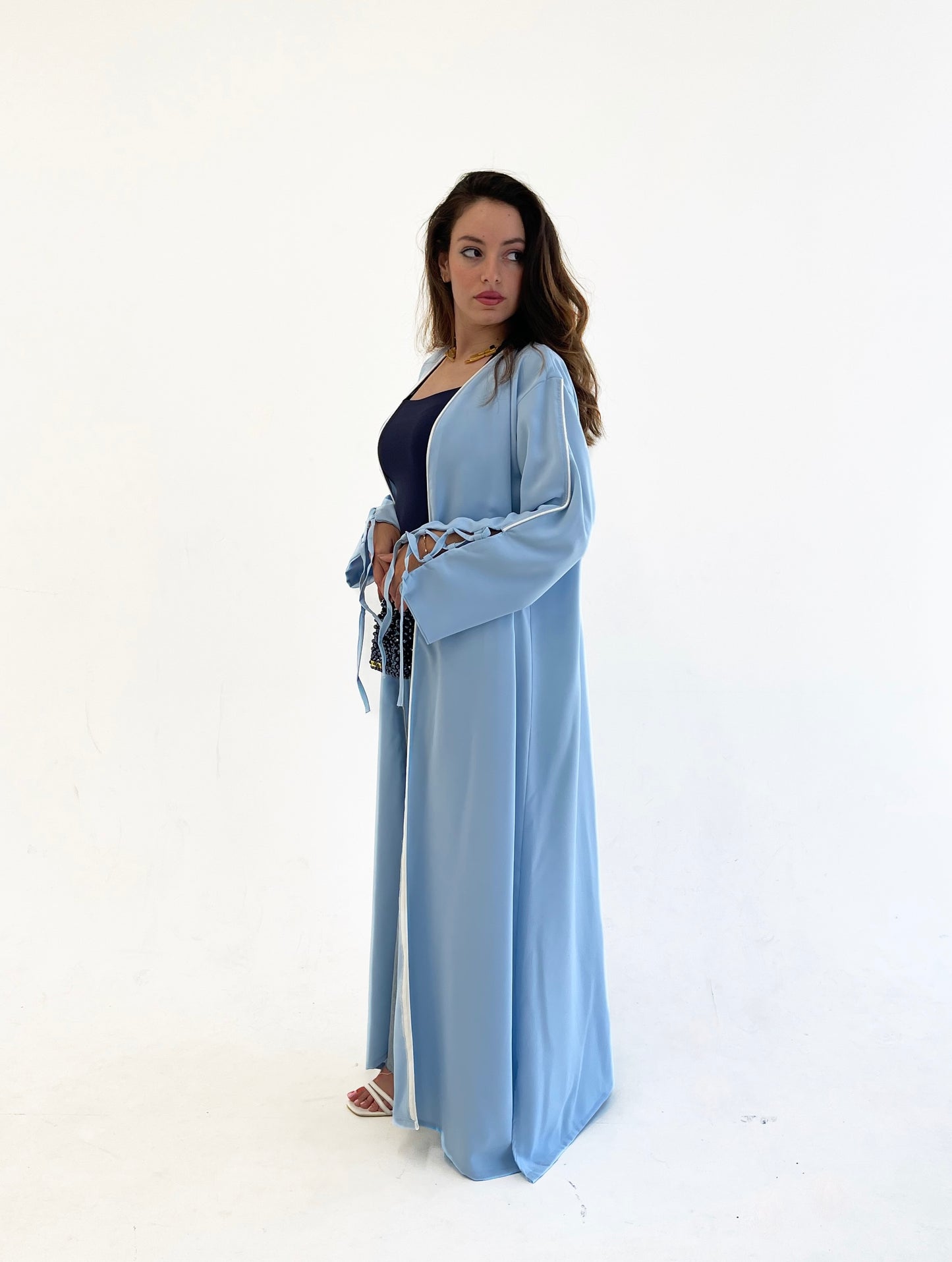 Dolly Baby blue Abaya with White details.